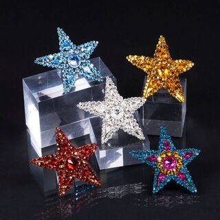 A Set of 5 sparkling Star Brooches 'Rive Gauche'