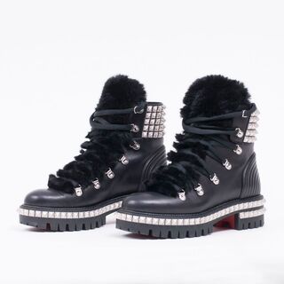 A Pair of Laced Studded Boots Yeti Donna