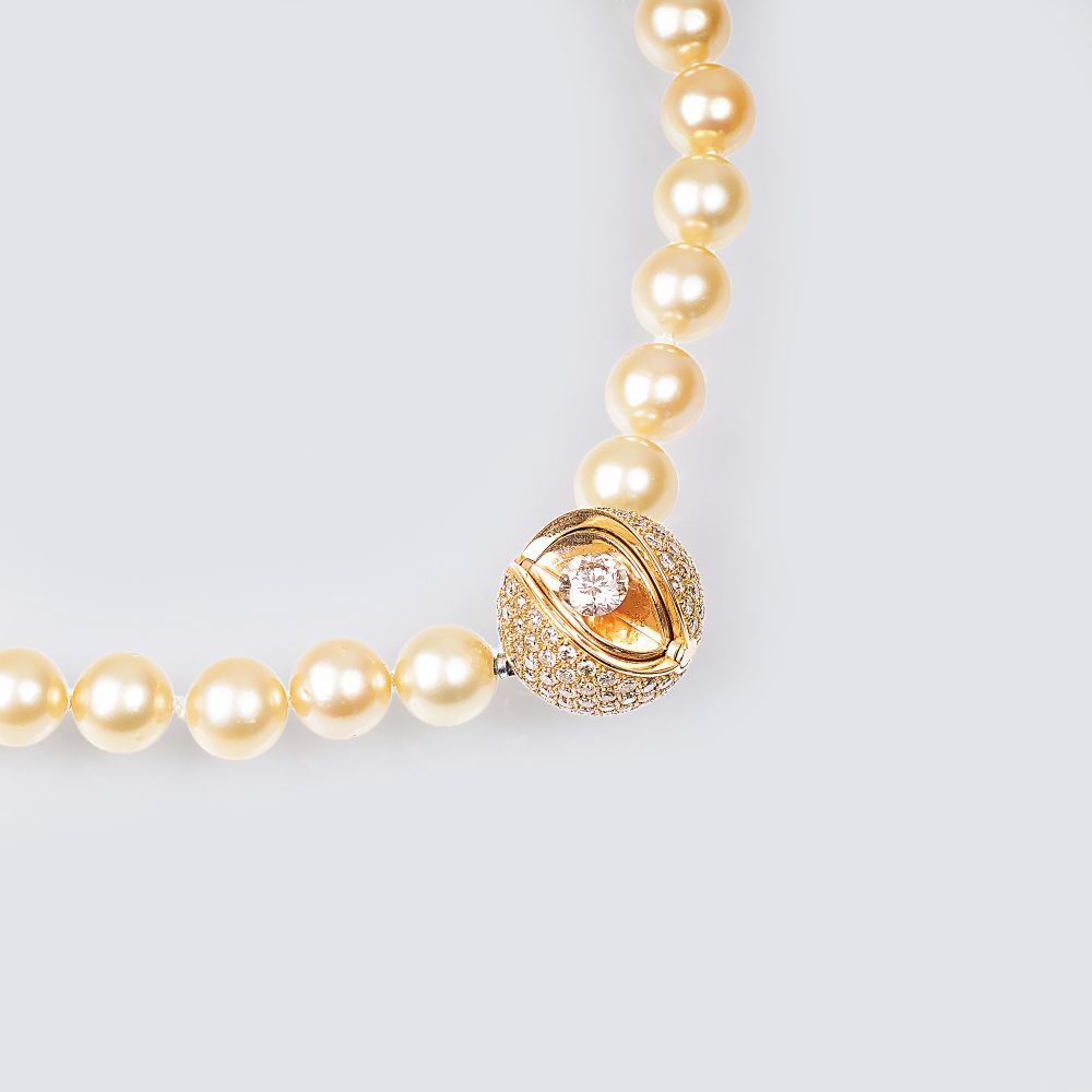 A Highcarat Solitaire Diamond Mystery Sphere Clasp on Pearl Necklace