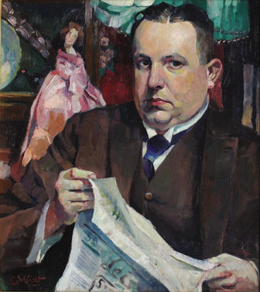 "A man reading a newspaper"