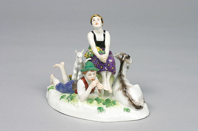 An animal figure 'shepherd couple with goat and kid'