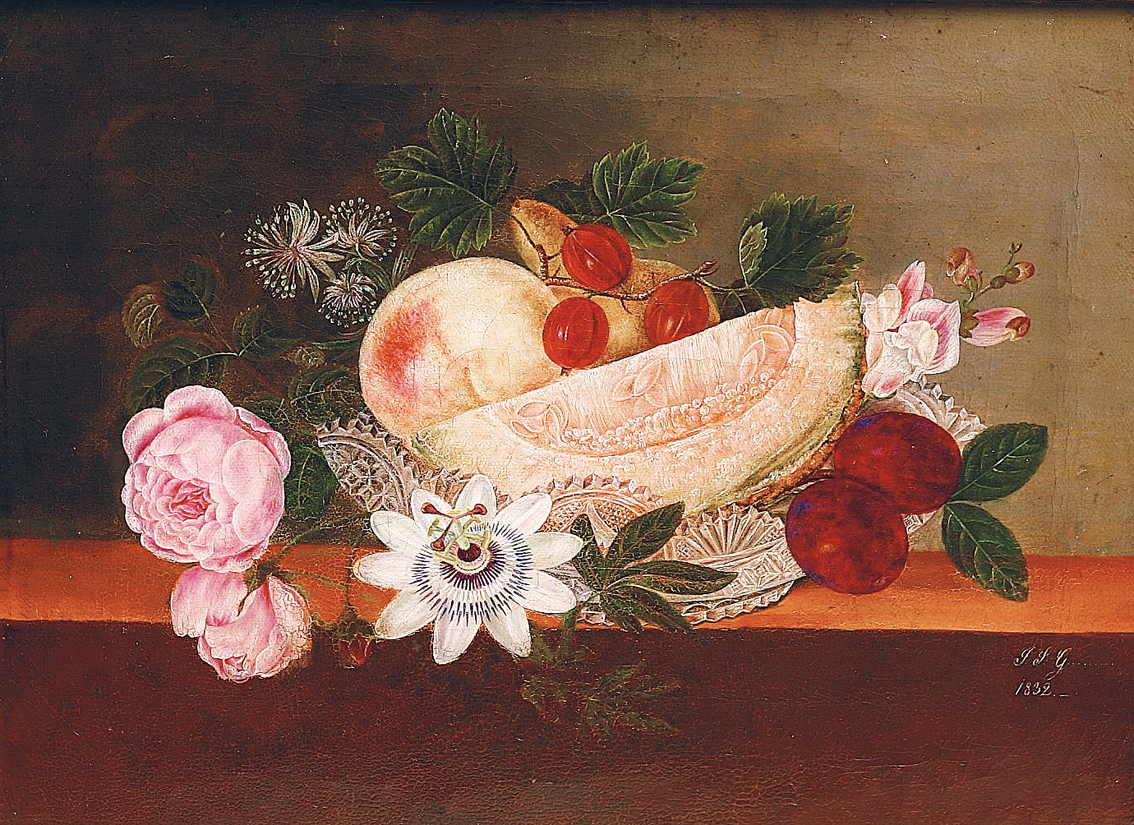 Fruits and flowers in a crystal-bowl on a board