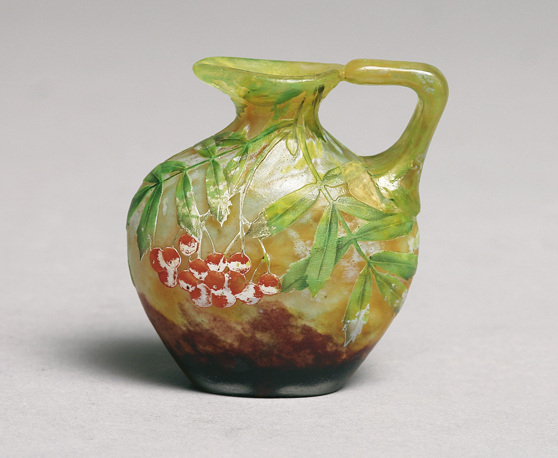 A small art-nouveau vase decorated with 'cherry branches'