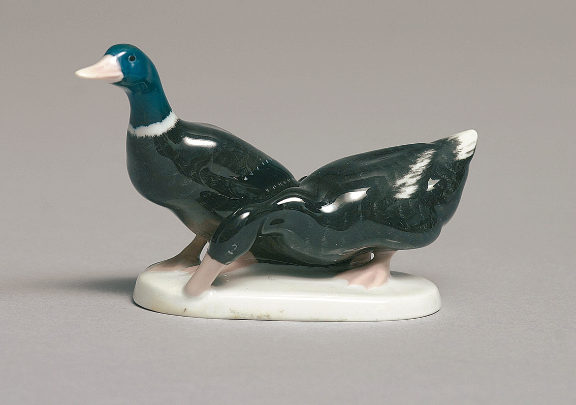 An animal figure of a duck couple'