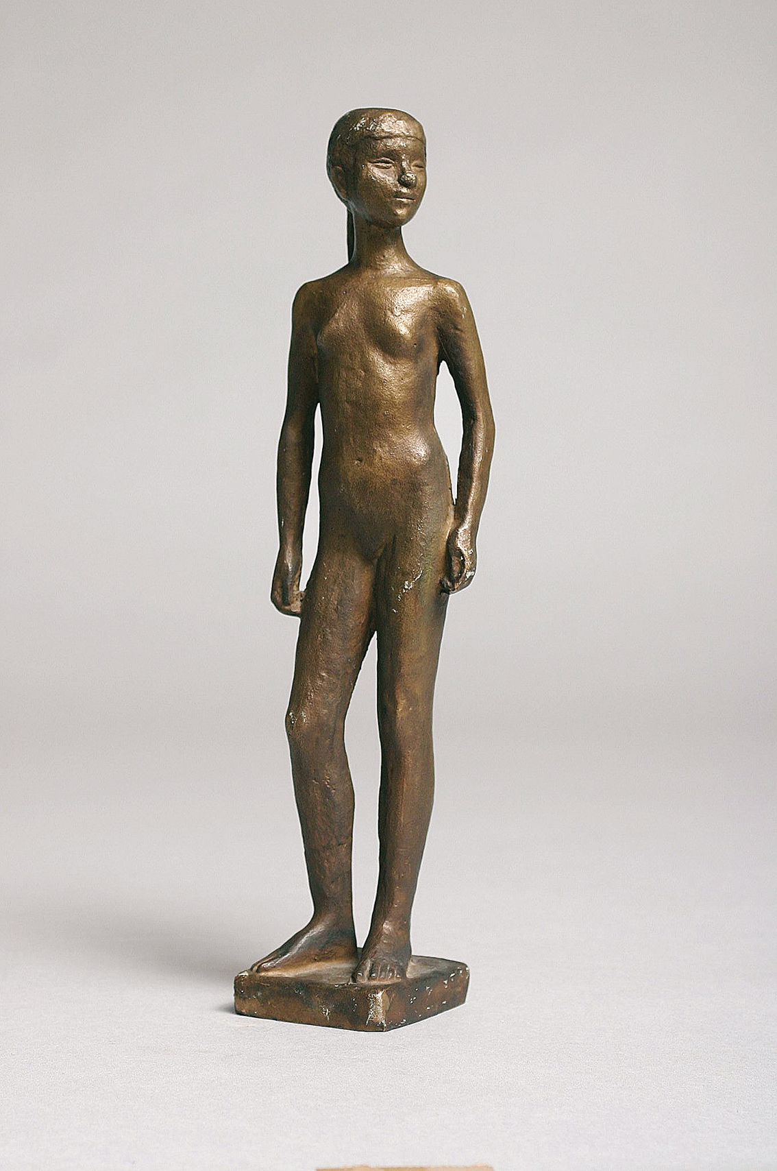 A small modern bronze figure 'Standing female nude'