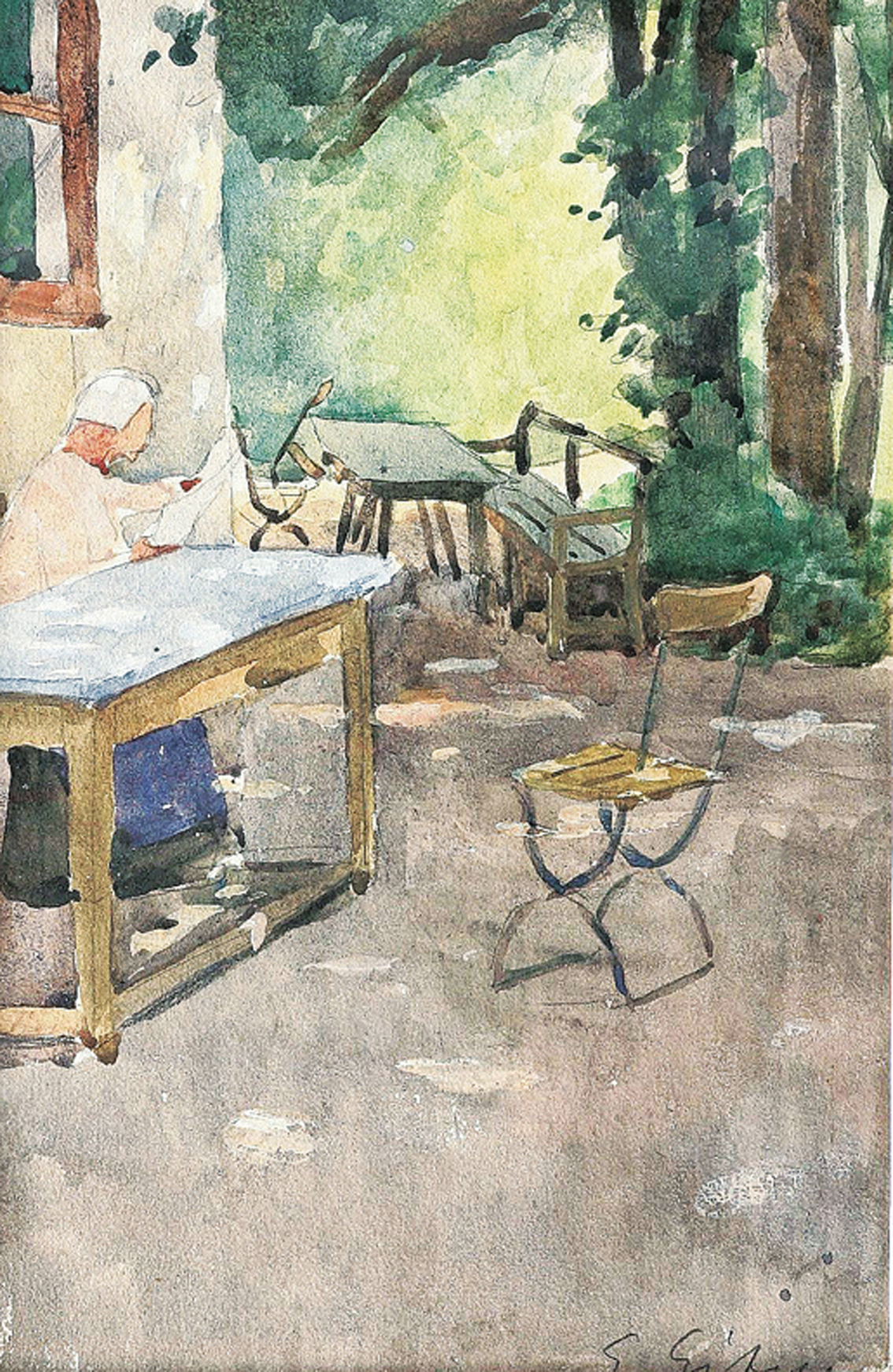"A woman reading a newspapewr in a pub garden"