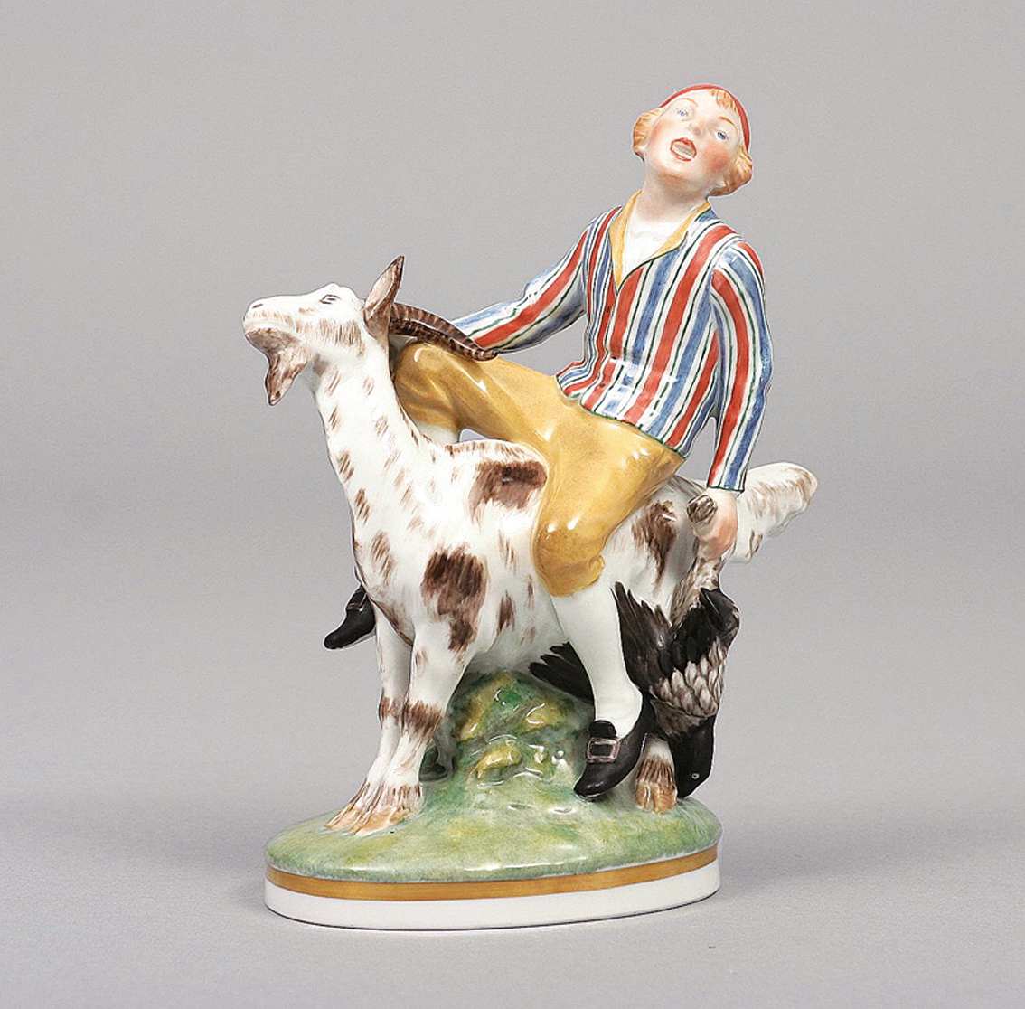 A group of figures 'Hans Clodhopper riding a goat'
