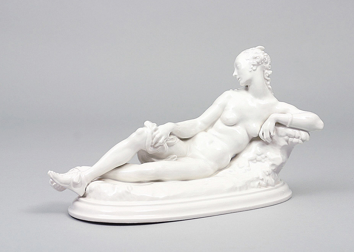 A white porcelain figure of a 'lying nymph'