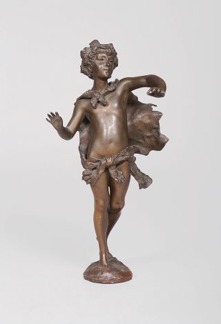 A bronze figure 'Boy with grapes in his hair'