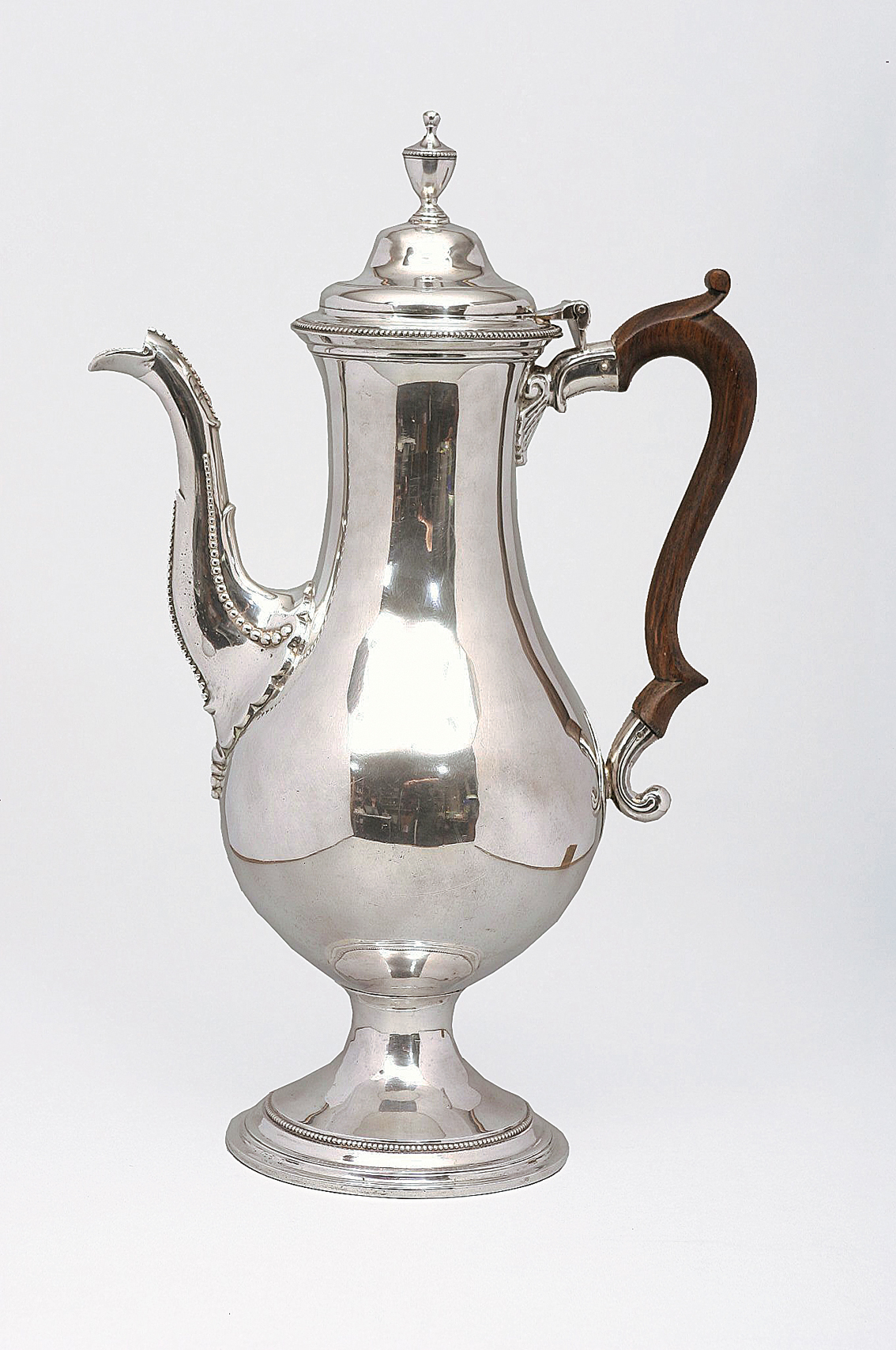 A large English coffee pot with noble coat of arms