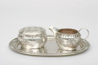 An elegant sugar cream set with tray