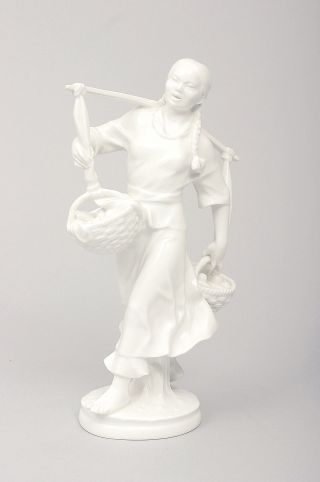 A figure of a Korean woman in white porcelain