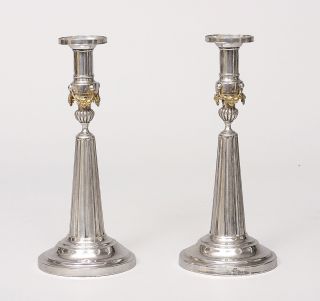 A pair of Louis-Seize candlesticks with garland ornaments