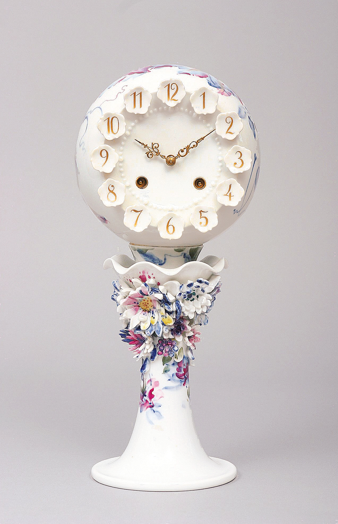 A rare modern model of a clock with floral decoration