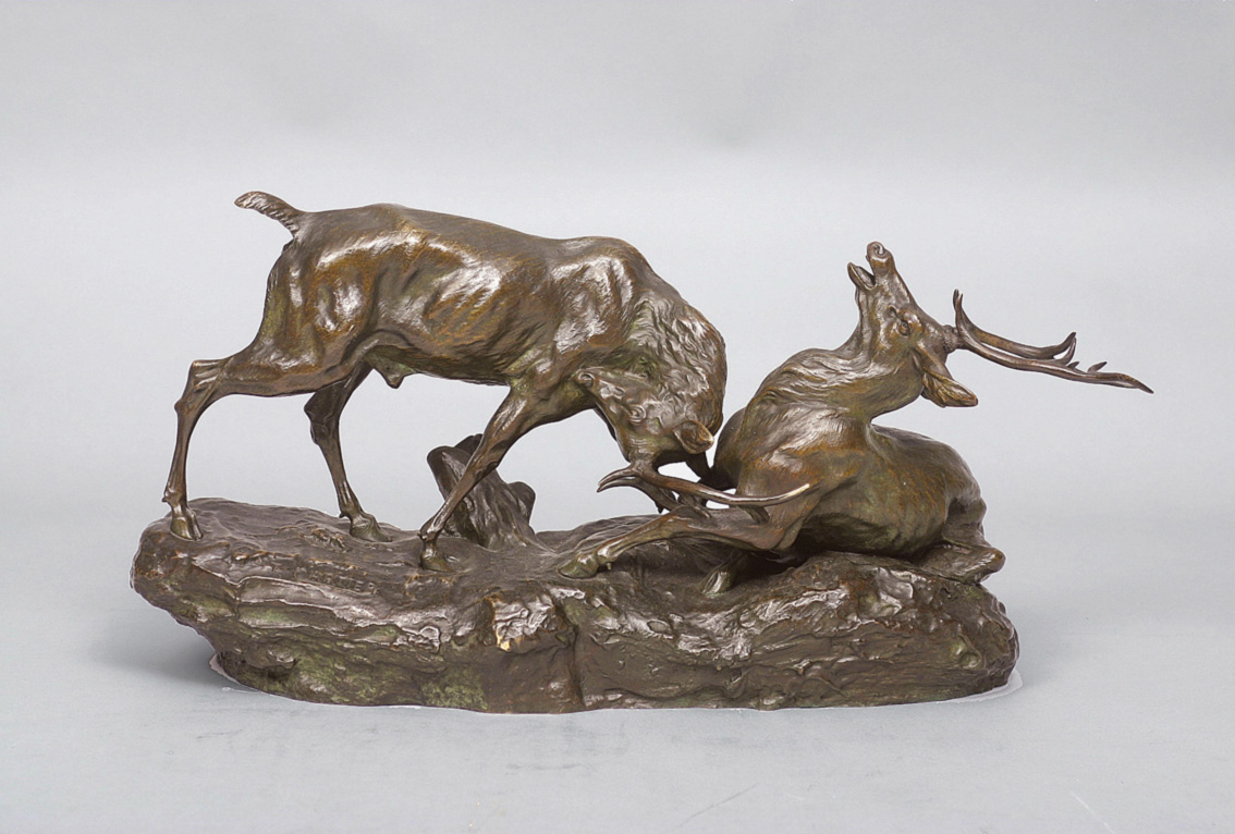 A large bronze 'Fighting deer'