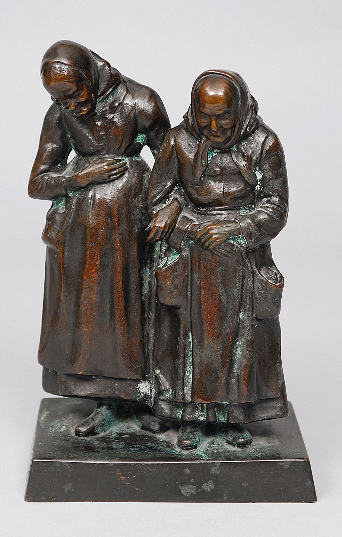 A bronzefigur 'two farmer-women with headscarves'