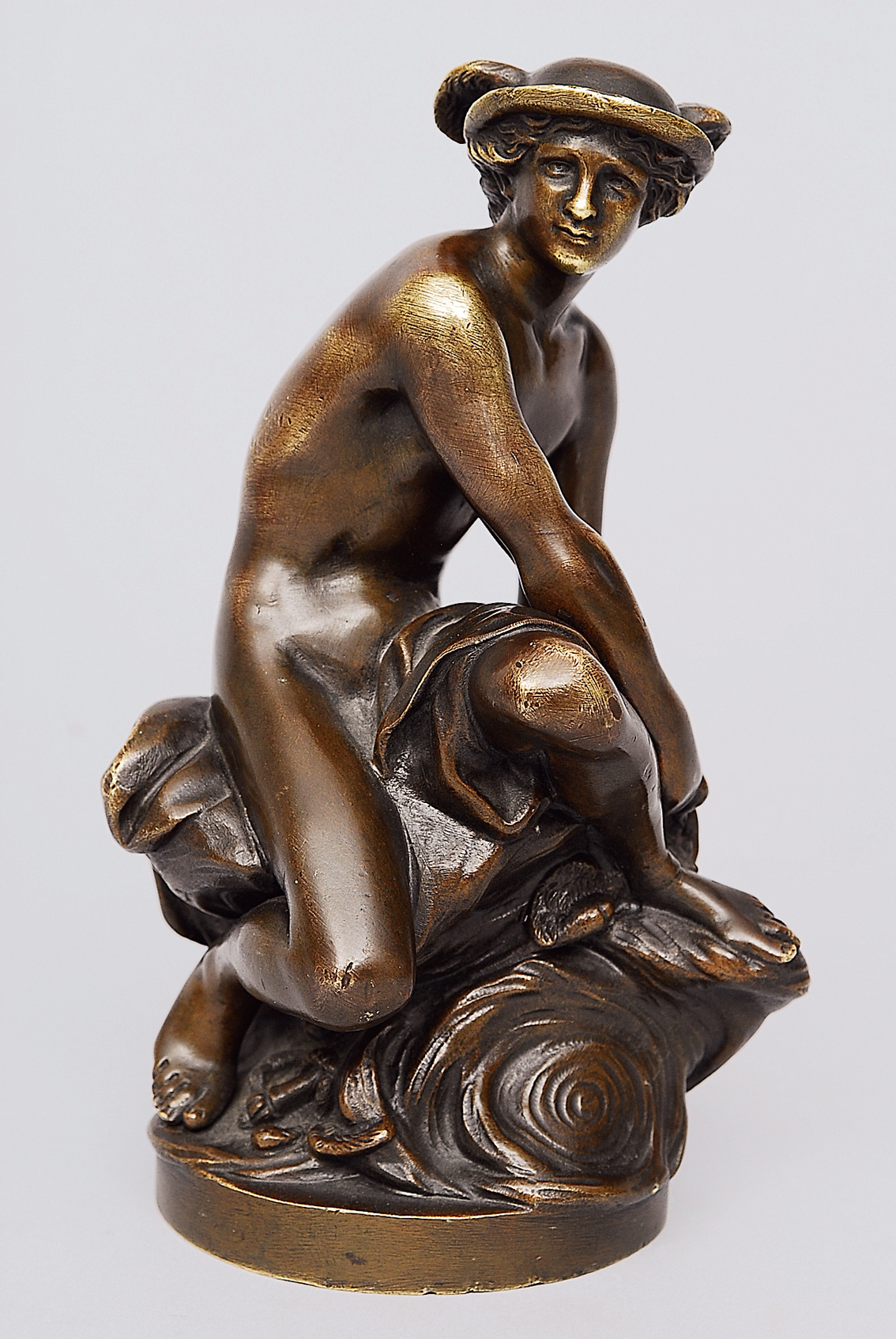 A bronze figure "The sitting Mercury"