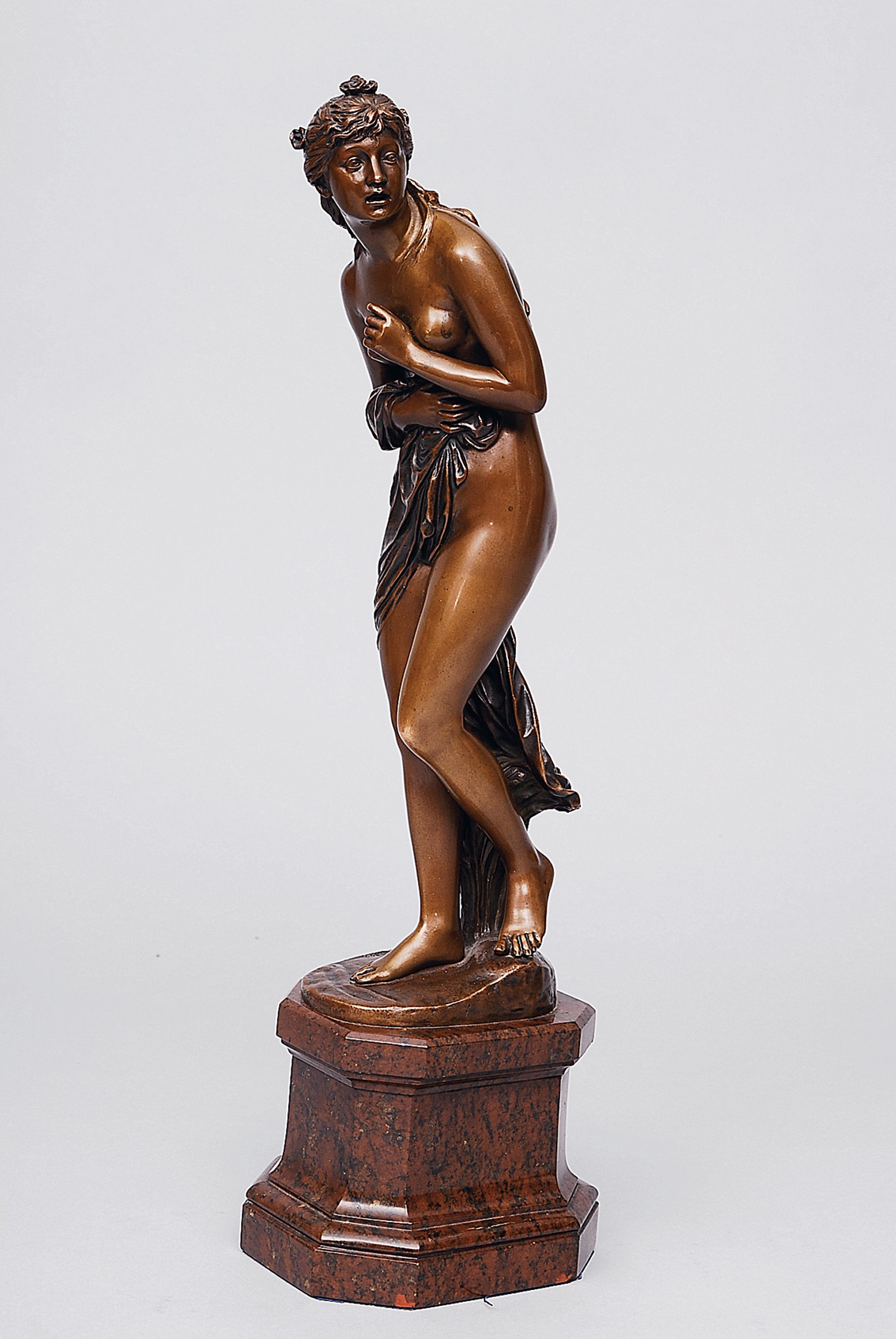 A bronze figure 'A nymphe caught by surprise during bathing'