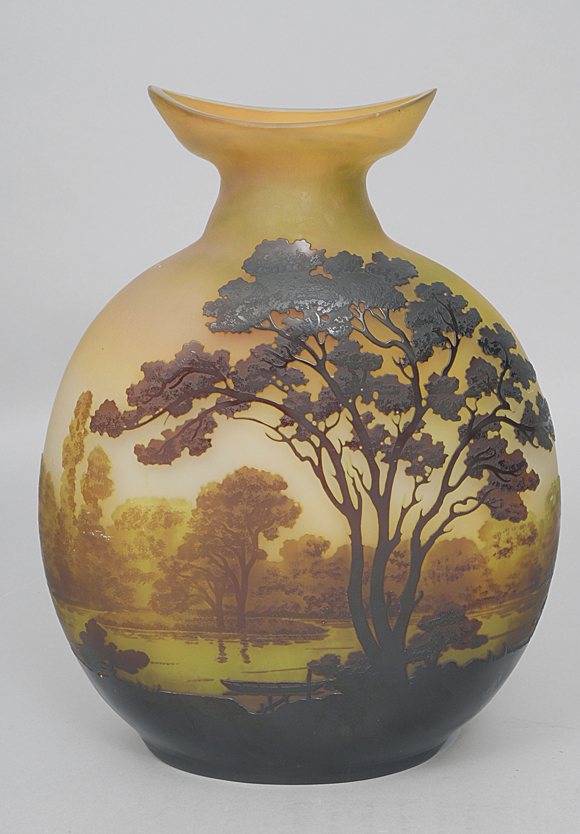 A large art nouveau vase with river landscapes