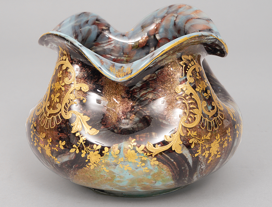 An art nouveau vase with gilt decoration