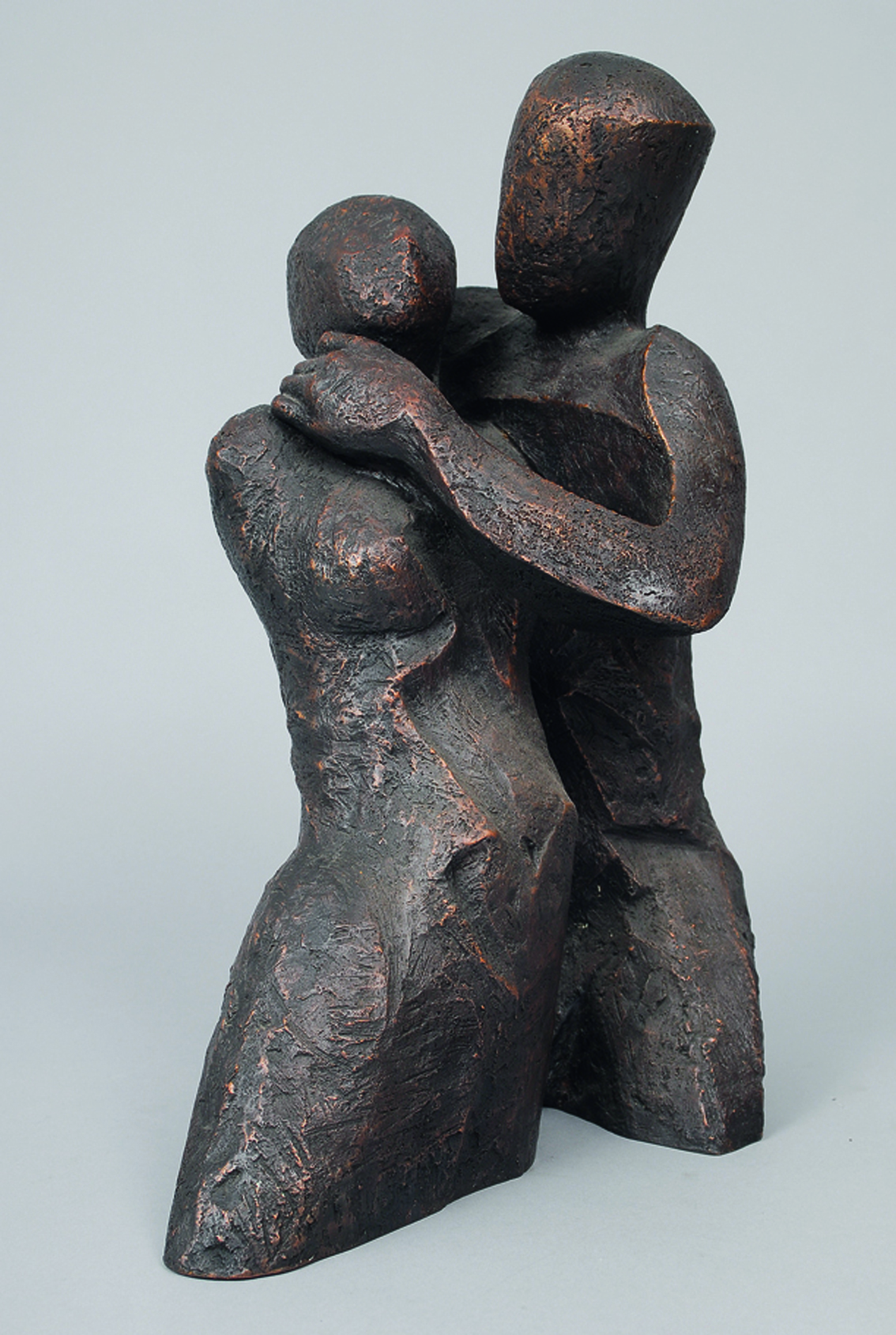 A bronze figure of a loving couple