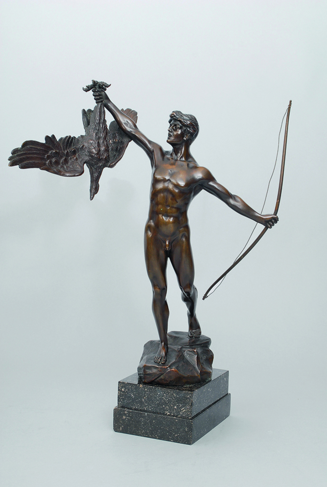 A bronze figure 'Young man with eagle'