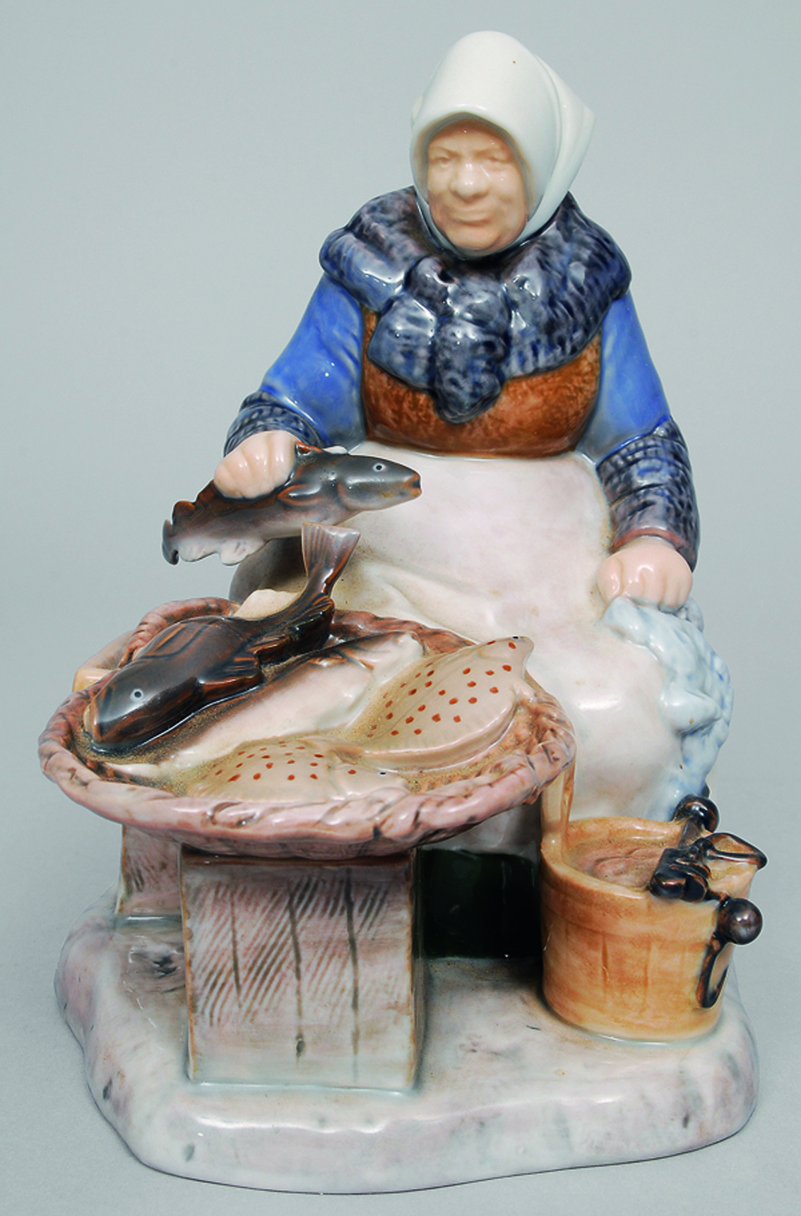 A figure of an old woman with fish