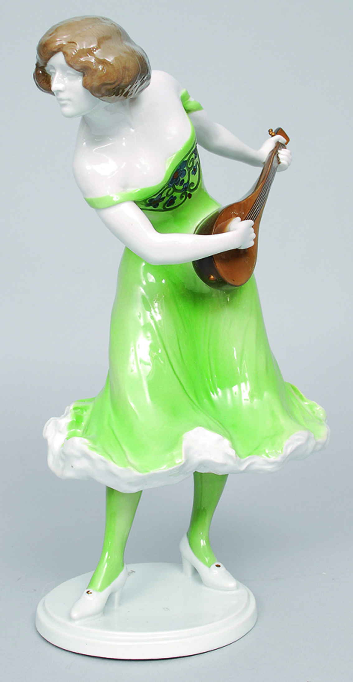 A large art nouveau figure of woman playing the mandolin