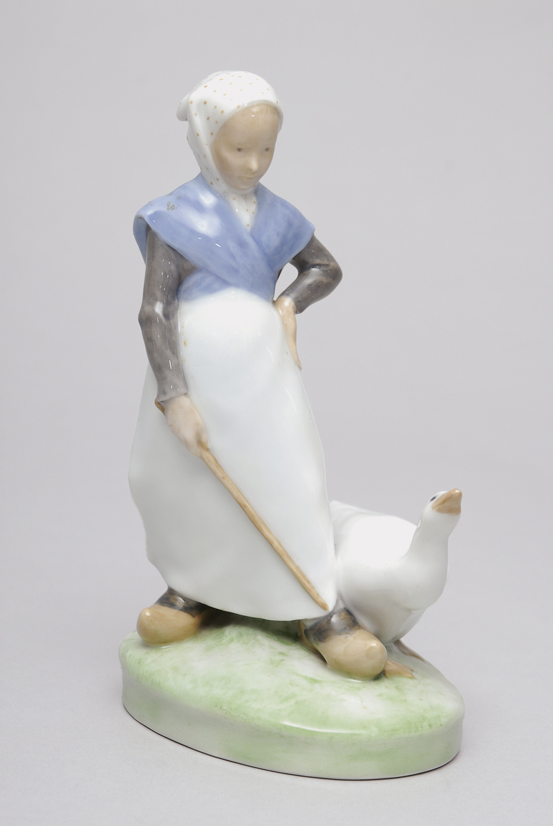 A figure of a girl with a goose