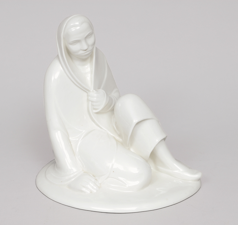 A figure of a sitting girl