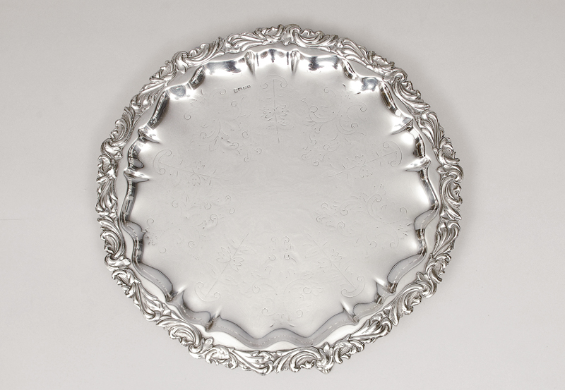 An English tray with floral relief decoration by John Sherwood