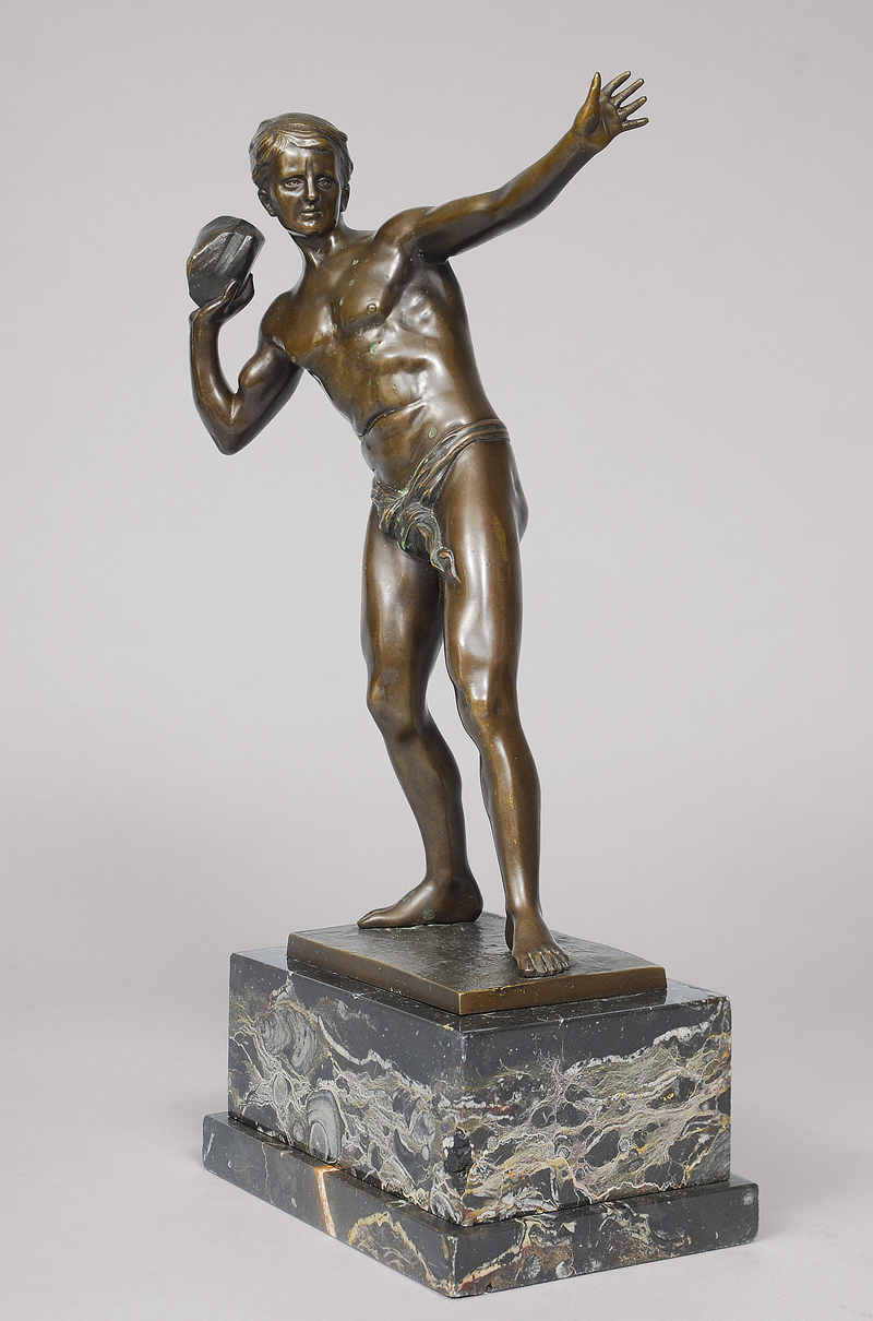 A classical bronze figure 'Throwing a stone'