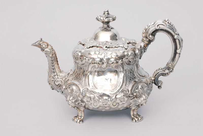 An english Victorian tea pot with moulded decoration