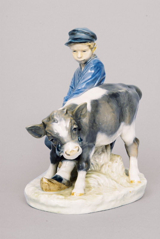 A figurine 'Cowboy with balky calf'