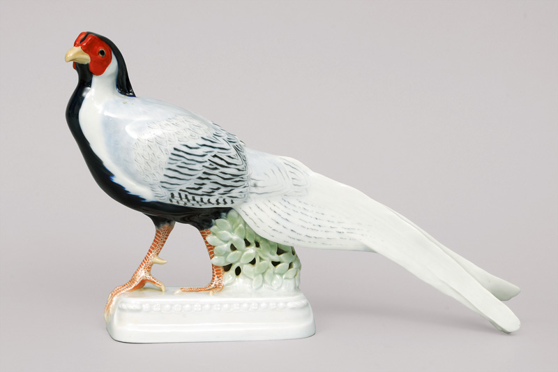 An expressive bird figurine 'marching pheasant' on moulded base