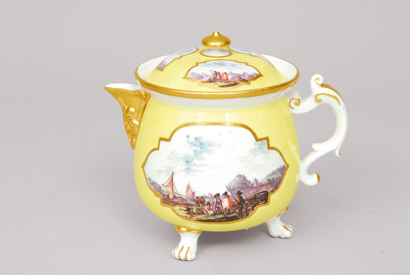 An early yellow grounded creamer with fine painted tradesmen scene
