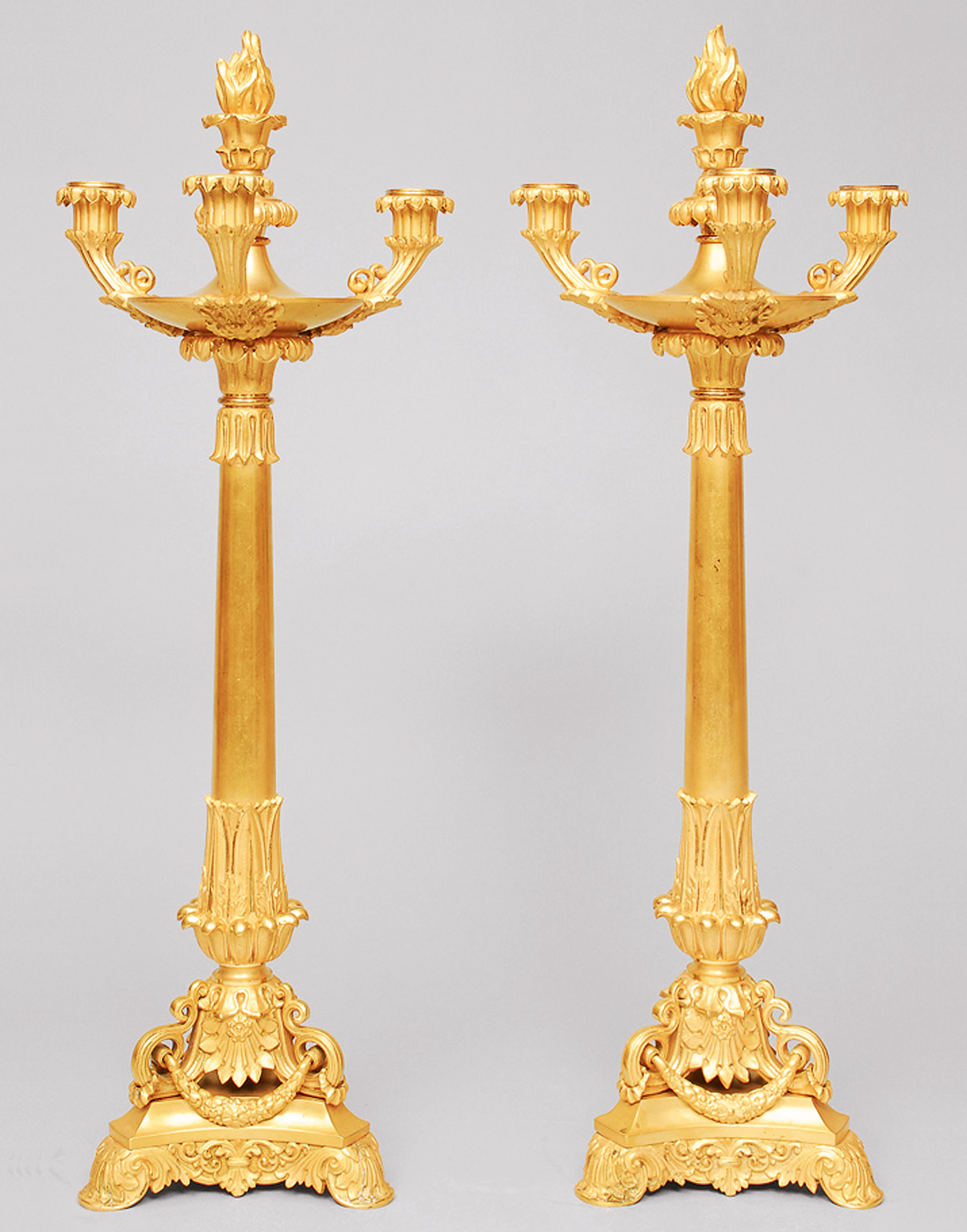 A pair of french Empire candle holders