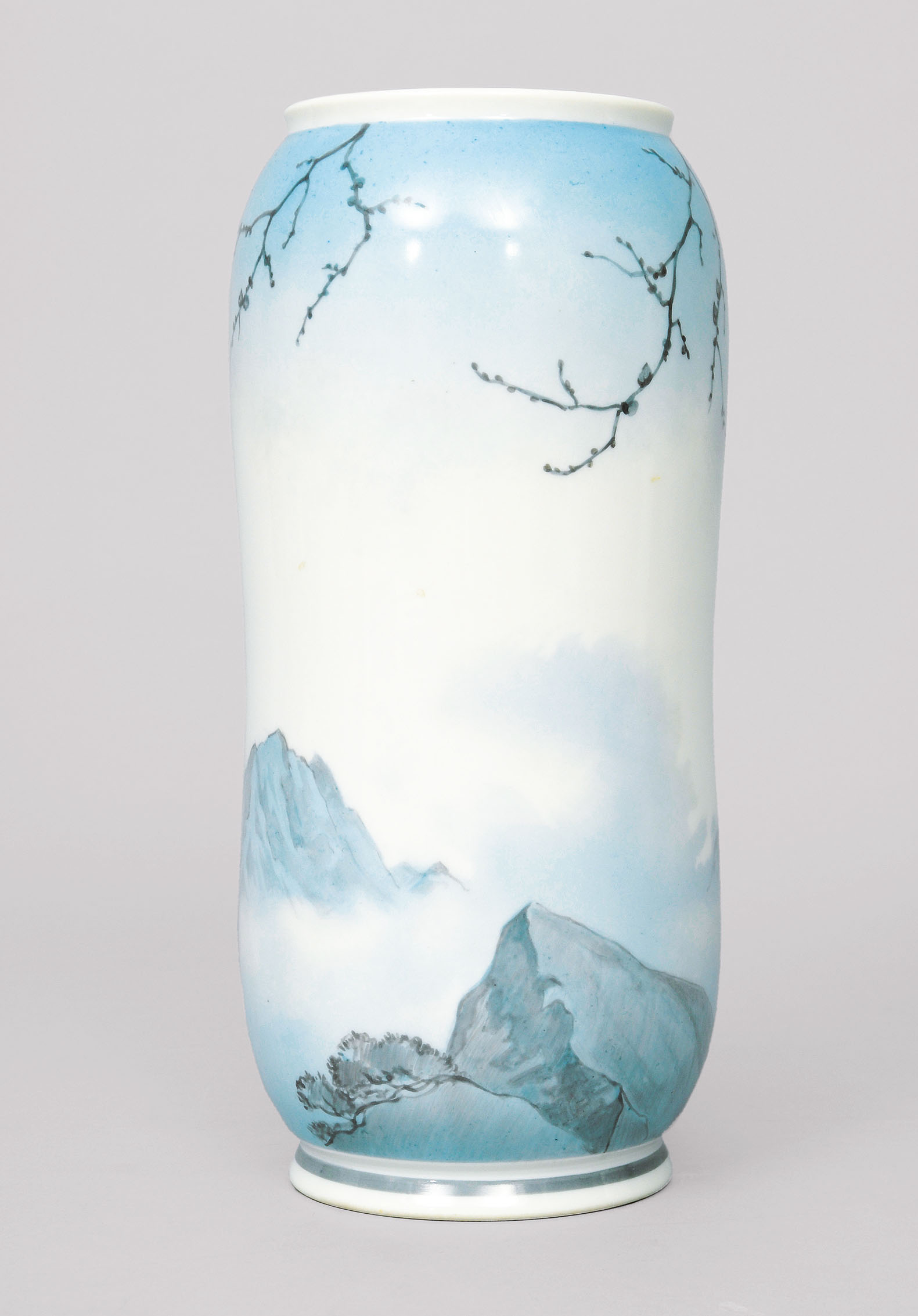 An Art-Nouveau vase with mountains