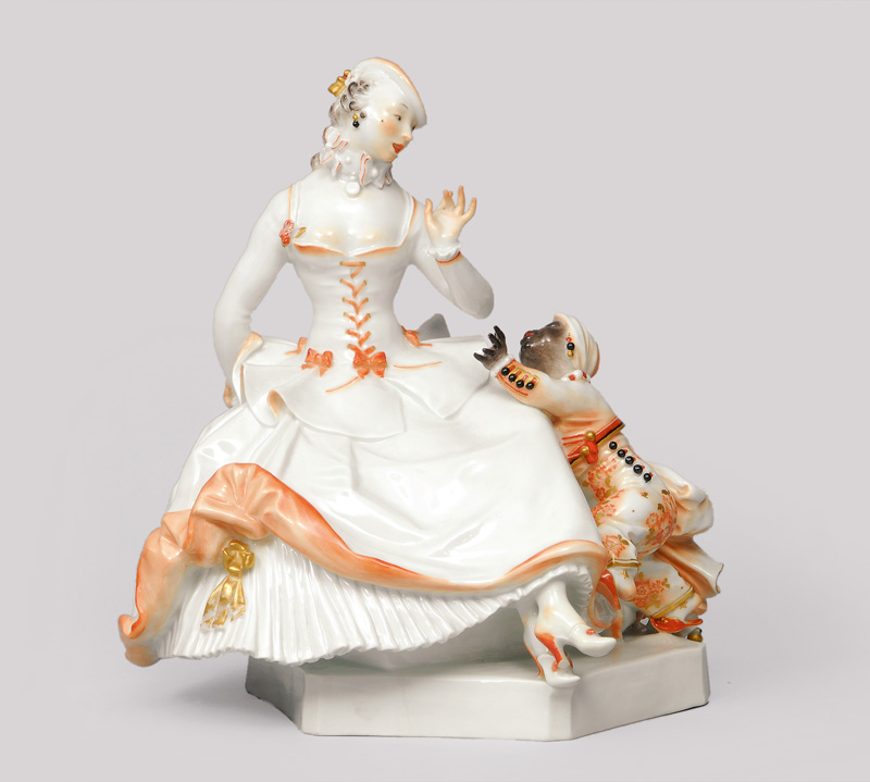 An Artr-Nouveau figurine group 'Lady with blackamoor boy'