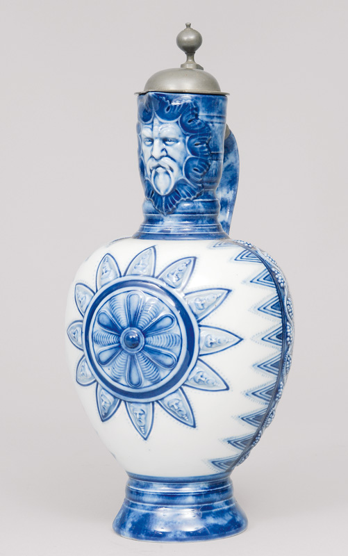 A jug with reliefed decoration in under glaze blue