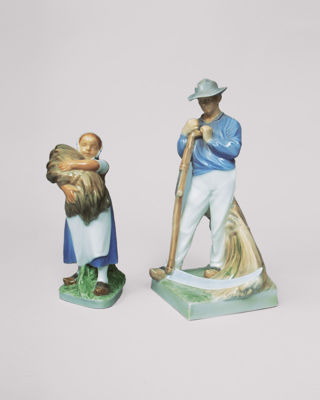 A pair of figurines 'farmer with scythe and girl with spikes'
