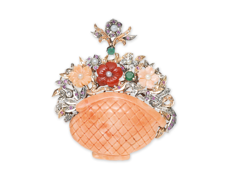 A flower brooch with coral and precious stones