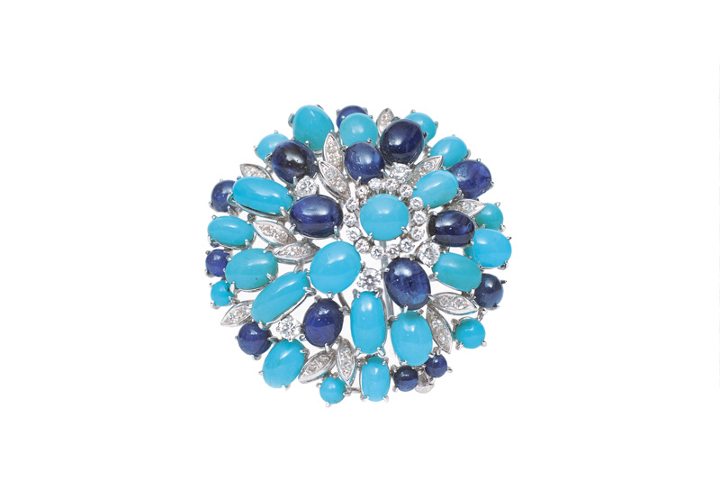 A modern sapphire diamond brooch with turquoise
