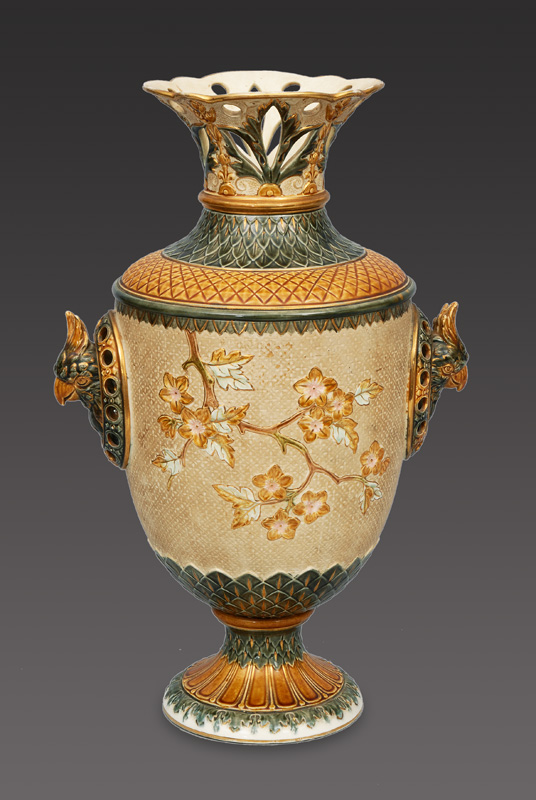 An amphora vase witth floral decoration and bird head handles