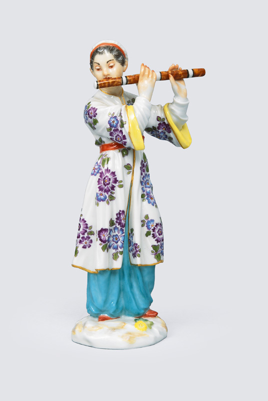 A figurine "Japanes playing the flute"