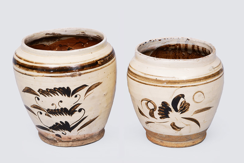 A pair of early pithoi with stylised floral decoration