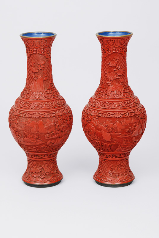 A pair of red lacquer vases