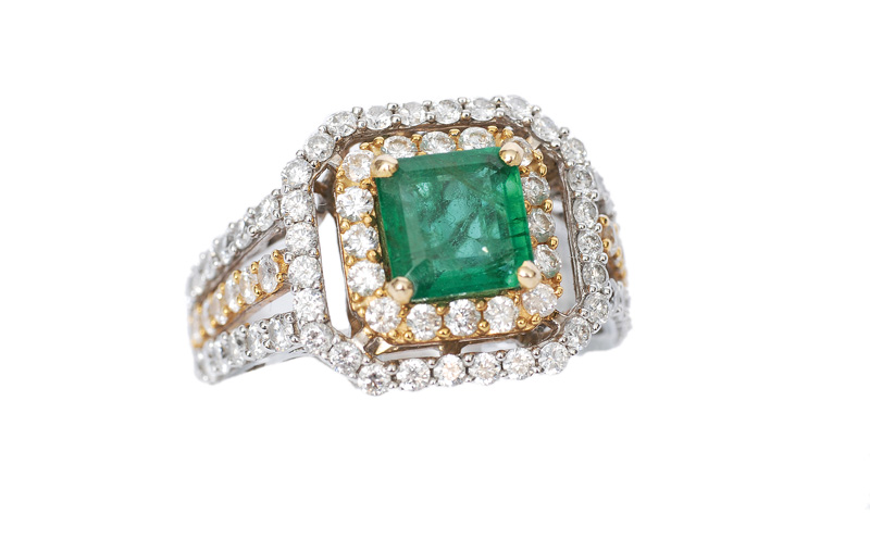 An emerald diamond ring