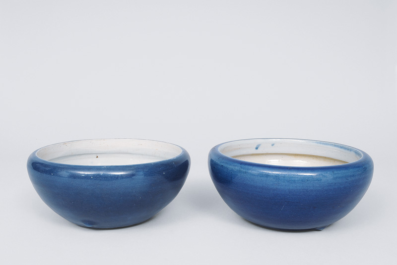 A pair of blue glazed bowls