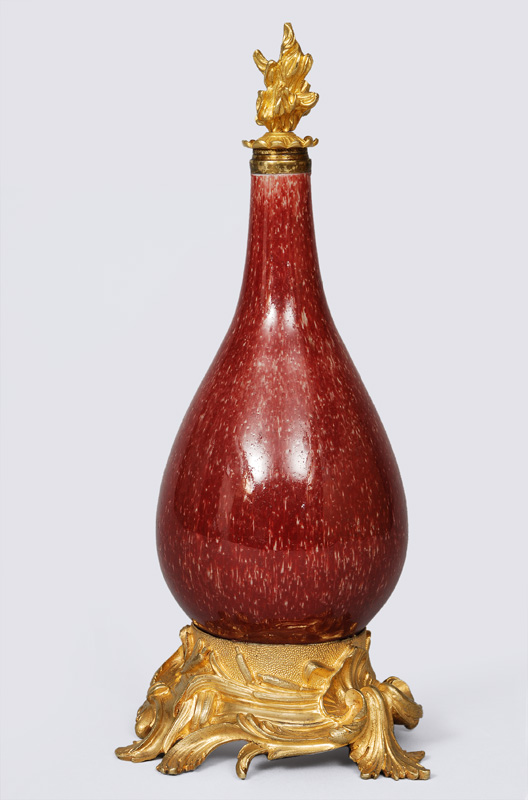 A sang-de-boeuf vase with gilded bronze mounting